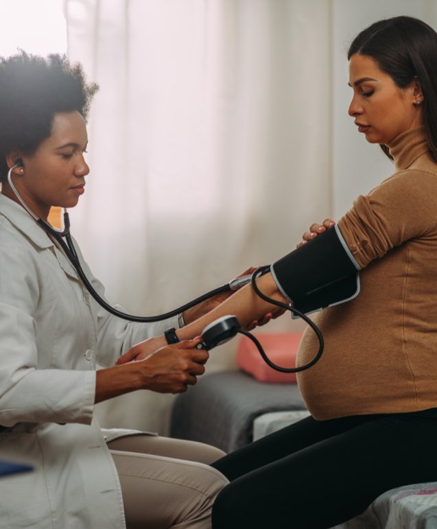 Doctor measuring blood pressure wide