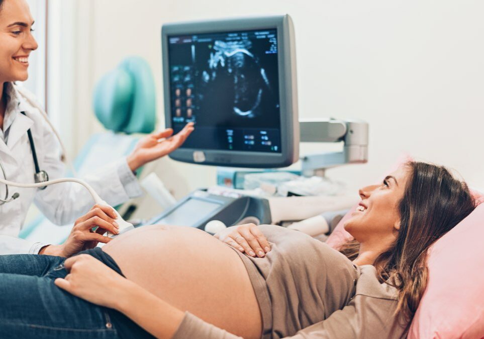 Pregnant woman watching her baby